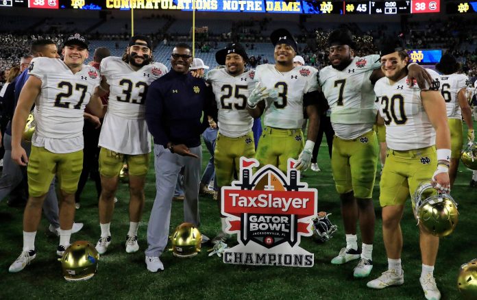 Notre Dame celebrates their win against South Carolina at TIAA Jacksonville Stadium during the Taxslayer Gator Bowl Championship