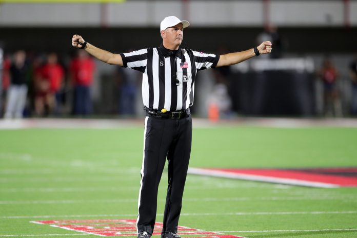 Which referee crew will be in charge of the on-field action during the Peach Bowl between Ole Miss and Penn State? They're a crew famous for one specific play.