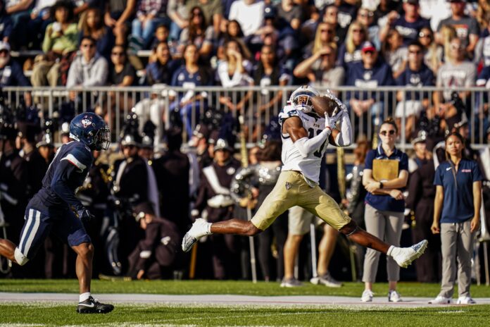 FIU Golden Panthers wide receiver Kris Mitchell (10) makes the catch and runs for a touchdown against the UConn Huskies in the second quarter at Rentschler Field at Pratt & Whitney Stadium.