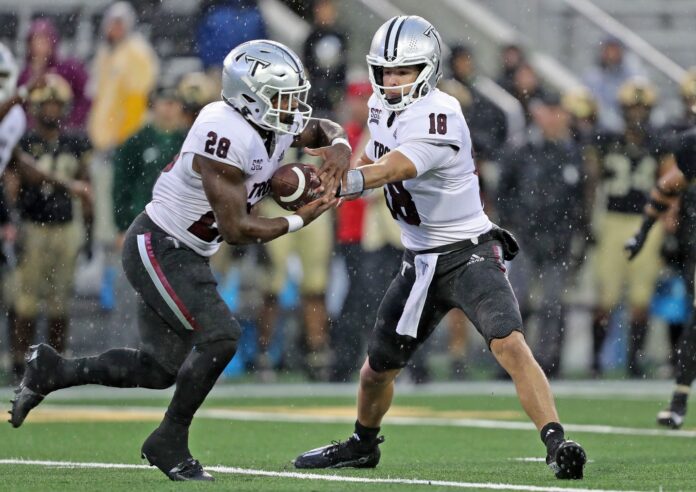 Troy Trojans quarterback Gunnar Watson (18) hands off the ball to running back Kimani Vidal (28) during the second half against the Army Black Knights at Michie Stadium.