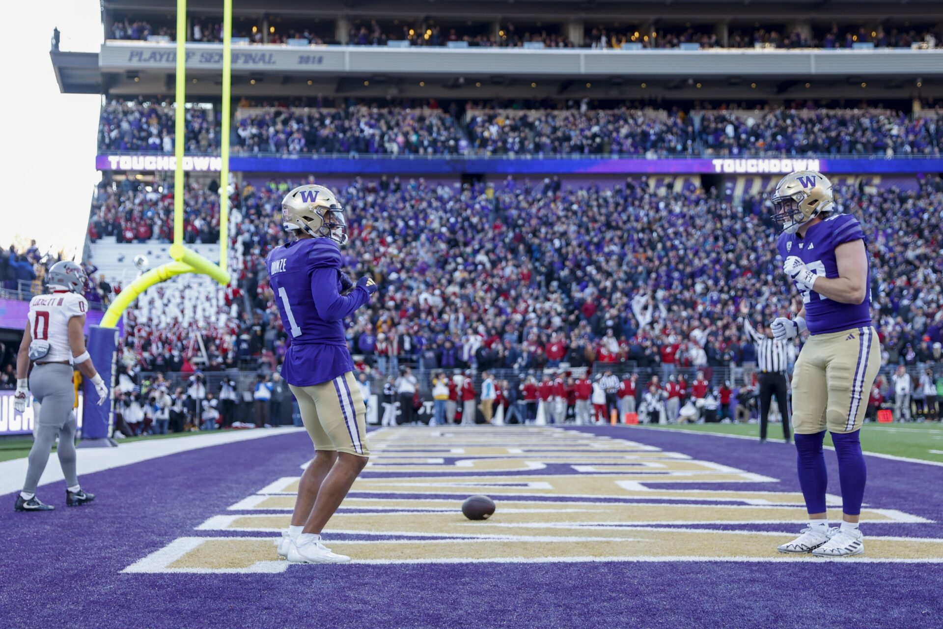Washington Huskies wide receiver Rome Odunze (1) celebrates after catching a touchdown pass against the Washington State Cougars during the second quarter at Alaska Airlines Field at Husky Stadium.