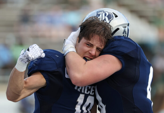 Rice Owls wide receiver Luke McCaffrey (10) celebrates with fullback Geron Hargon (44) after scoring a touchdown against the Tulane Green Wave in the second half at Rice Stadium.