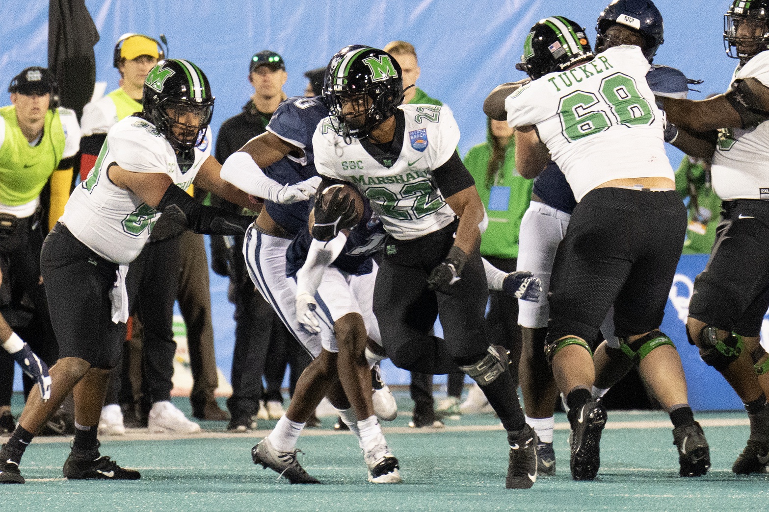 Marshall Thundering Herd running back Rasheen Ali (22) breaks a tackle in the second half against the Connecticut Huskies at Brooks Stadium.