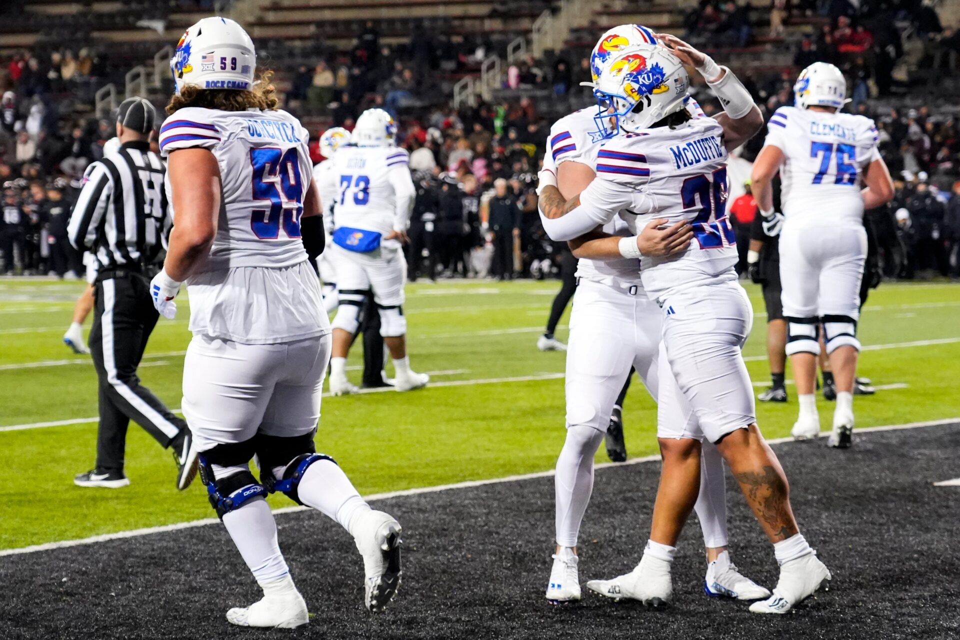 Kansas Jayhawks running back Dylan McDuffie (25) celebrates a touchdown with his team in the end zone during the NCAA college football game between the Cincinnati Bearcats and Kansas Jayhawks.