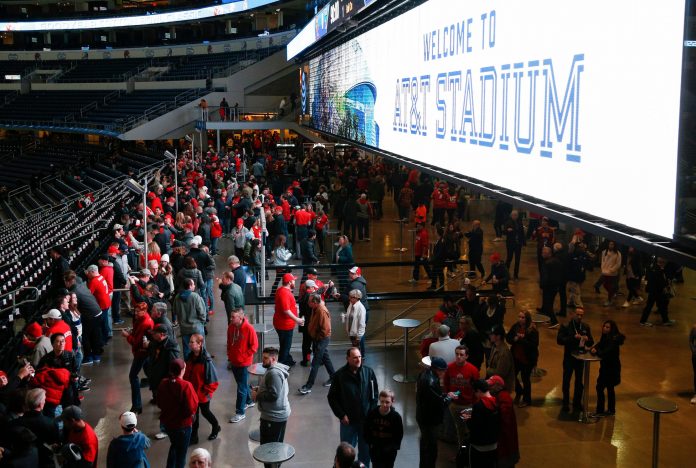 Fans file into AT&T Stadium before the Goodyear Cotton Bowl Classic between the Ohio State Buckeyes and the USC Trojans on Friday, December 29, 2017 in Arlington, Texas.
