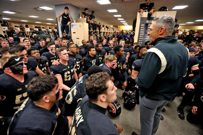 Army Black Knights head coach Jeff Monken speaks to his team in the locker room after a 28-21 win against the Coastal Carolina Chanticleers at Michie Stadium.