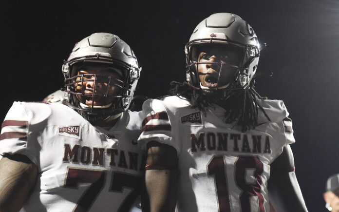 Montana Grizzlies wide receiver Samuel Akem (18) and guard Moses Mallory (77) celebrate a touchdown against the Eastern Washington Eagles in the first half at Roos Field.