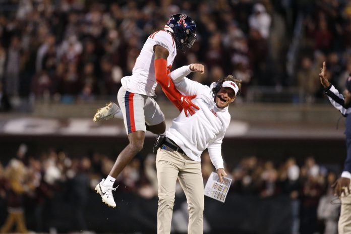 Mississippi Rebels defensive back Zamari Walton (6) and head coach Lane Kiffin (right) react after a missed field goal by the Mississippi State Bulldogs during the second half at Davis Wade Stadium at Scott Field.