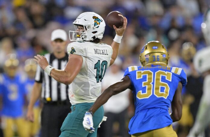 Coastal Carolina Chanticleers quarterback Grayson McCall (10) is pressured by UCLA Bruins defensive back Alex Johnson (36) in the first half at the Rose Bowl.