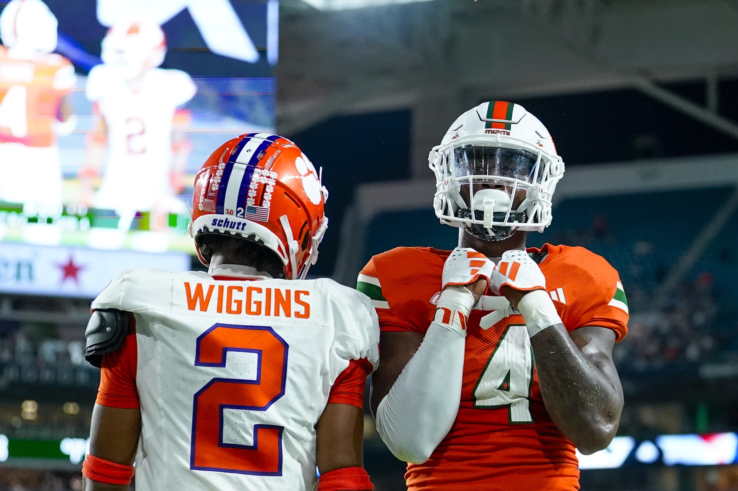 Miami Hurricanes wide receiver Colbie Young (4) celebrates scoring a touch down against Clemson Tigers cornerback Nate Wiggins (2) during the fourth quarter at Hard Rock Stadium.