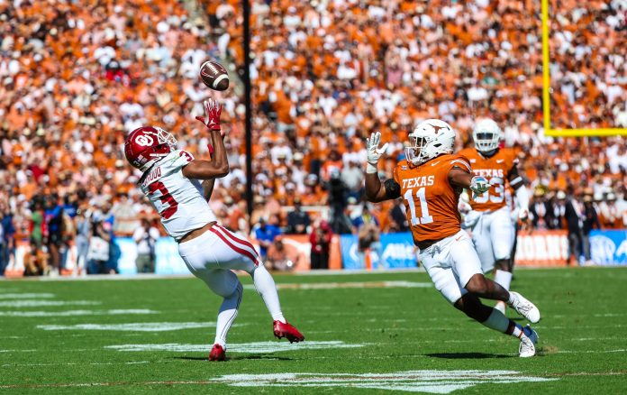 Oct 7, 2023; Dallas, Texas, USA; Oklahoma Sooners wide receiver Jalil Farooq (3) makes a catch as Texas Longhorns defensive back Jalen Catalon (11) defends during the first half at the Cotton Bowl.