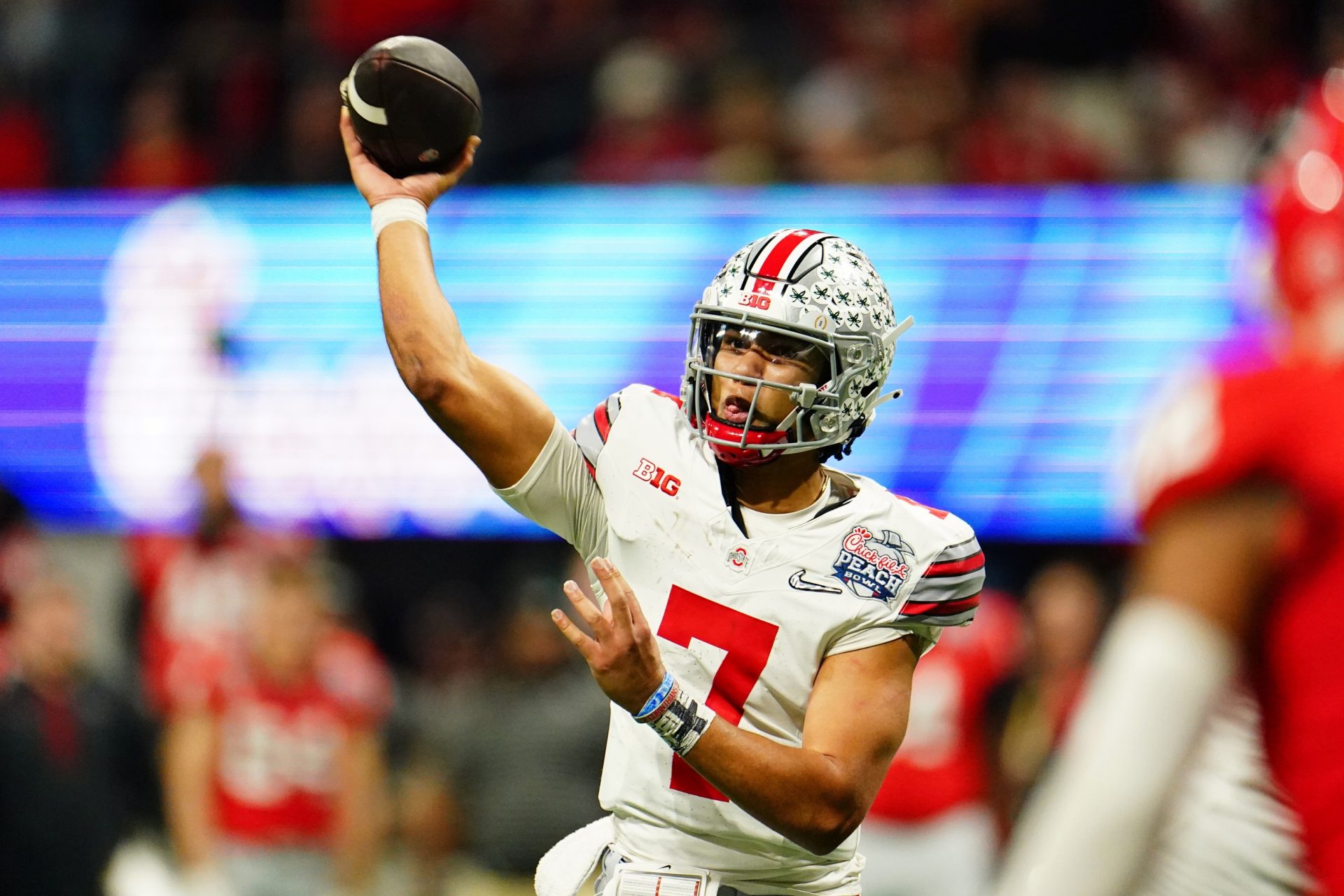 Ohio State Buckeyes quarterback C.J. Stroud (7) passes the ball against the Georgia Bulldogs during the third quarter of the 2022 Peach Bowl at Mercedes-Benz Stadium.