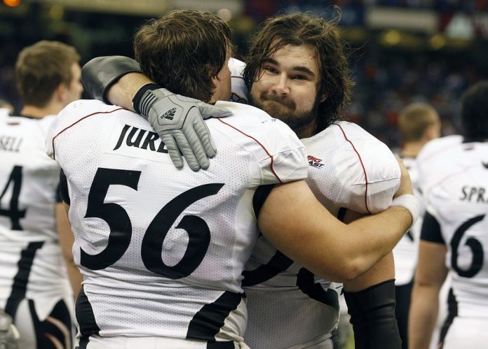 University of Cincinnati's Chris Jurek, left, and Jason Kelce console one another after The Bearcats lost 51-24 to the Florida Gators in the Sugar Bowl at the Louisiana Superdome.
