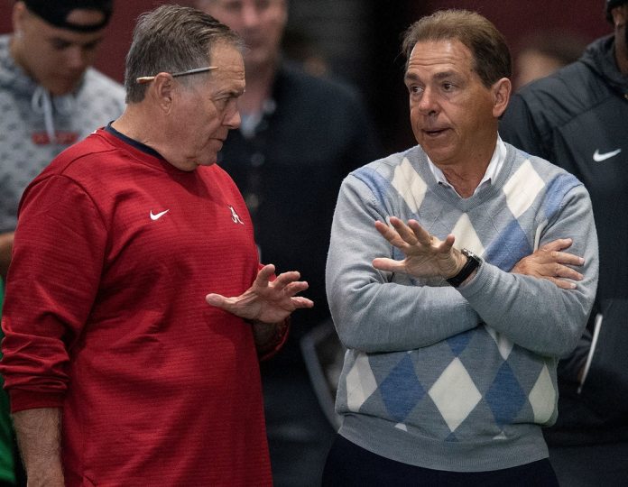 New England Patriots head coach Bill Belichick chats with Alabama head coach Nick Saban.
