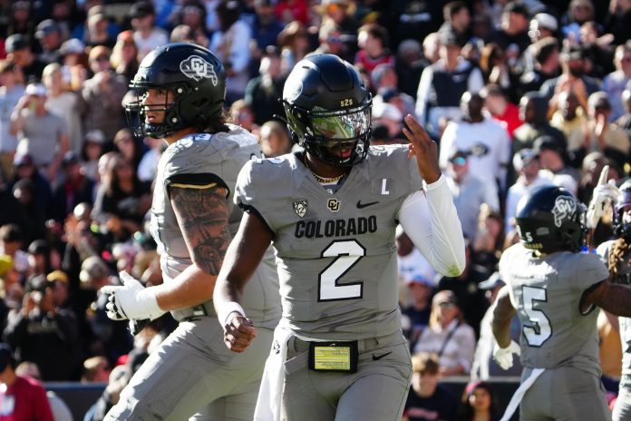 Nov 11, 2023; Boulder, Colorado, USA; Colorado Buffaloes quarterback Shedeur Sanders (2) celebrates after a touchdown against the Arizona Wildcats in the second quarter at Folsom Field. Mandatory Credit: Ron Chenoy-USA TODAY Sports