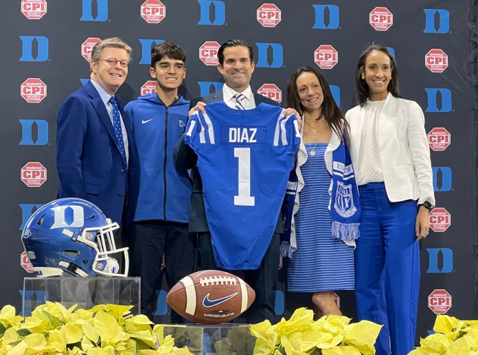 Manny Diaz, center, was introduced as Duke's football coach on Dec. 9, 2023 on campus inside the Pascal Field House.