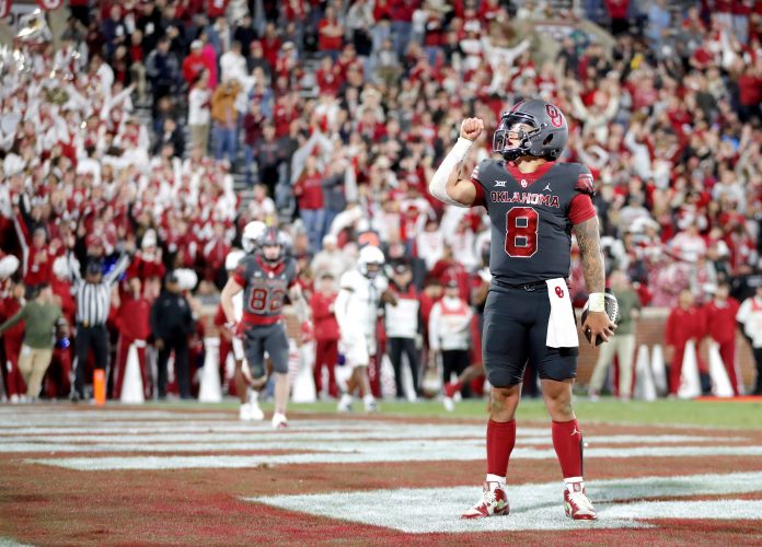 Oklahoma's Dillon Gabriel (8) reacts after scoring a touchdown in the second half of a college football game between the University of Oklahoma Sooners and the West Virginia Mountaineers at Gaylord Family-Oklahoma Memorial Stadium in Norman, Okla., Saturday, Nov., 11, 2023.