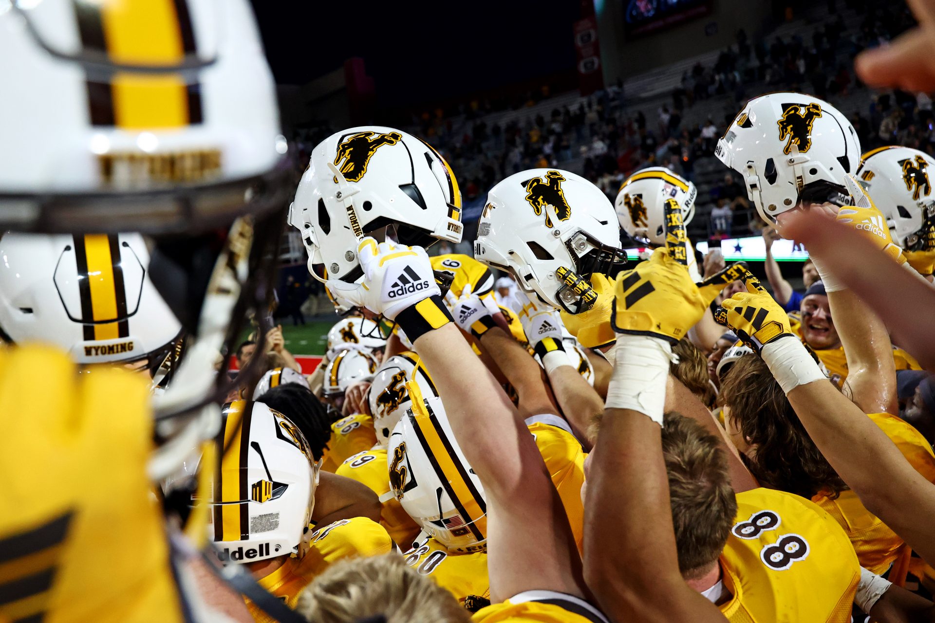 Dec 30, 2023; Tucson, AZ, USA; The Wyoming Cowboys celebrate after beating the Toledo Rockets in the Arizona Bowl at Arizona Stadium. Mandatory Credit: Mark J. Rebilas-USA TODAY Sports