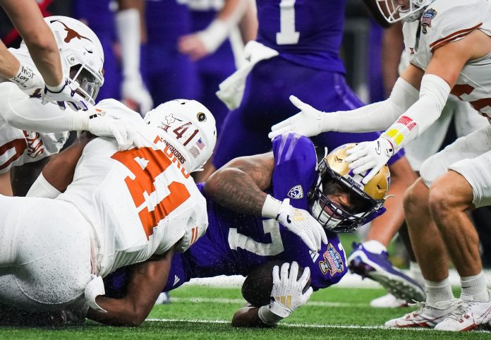 Washington RB Dillon Johnson exited the Sugar Bowl against Texas and all focus shifts toward his status for the National Championship against Michigan.