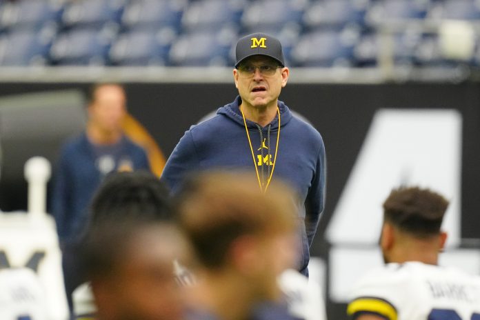 Jim Harbaugh has an elaborate plan for college football players to benefit from profit-sharing. Find out what the Michigan head coach told the media