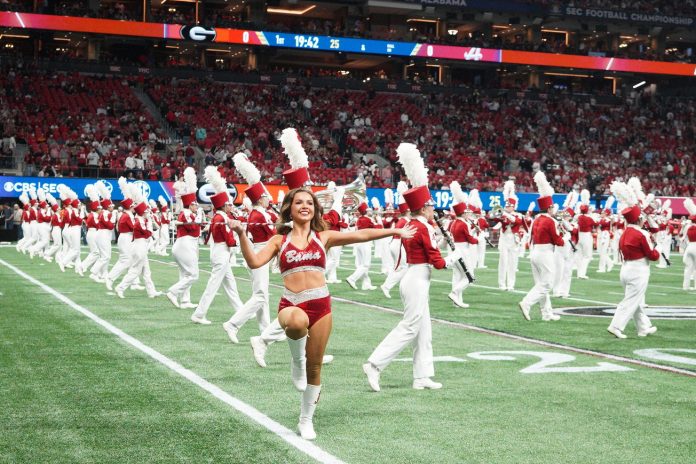 The Alabama Crimson Tide marching band performs before the SEC Championship game against the Georgia Bulldogs at Mercedes-Benz Stadium.
