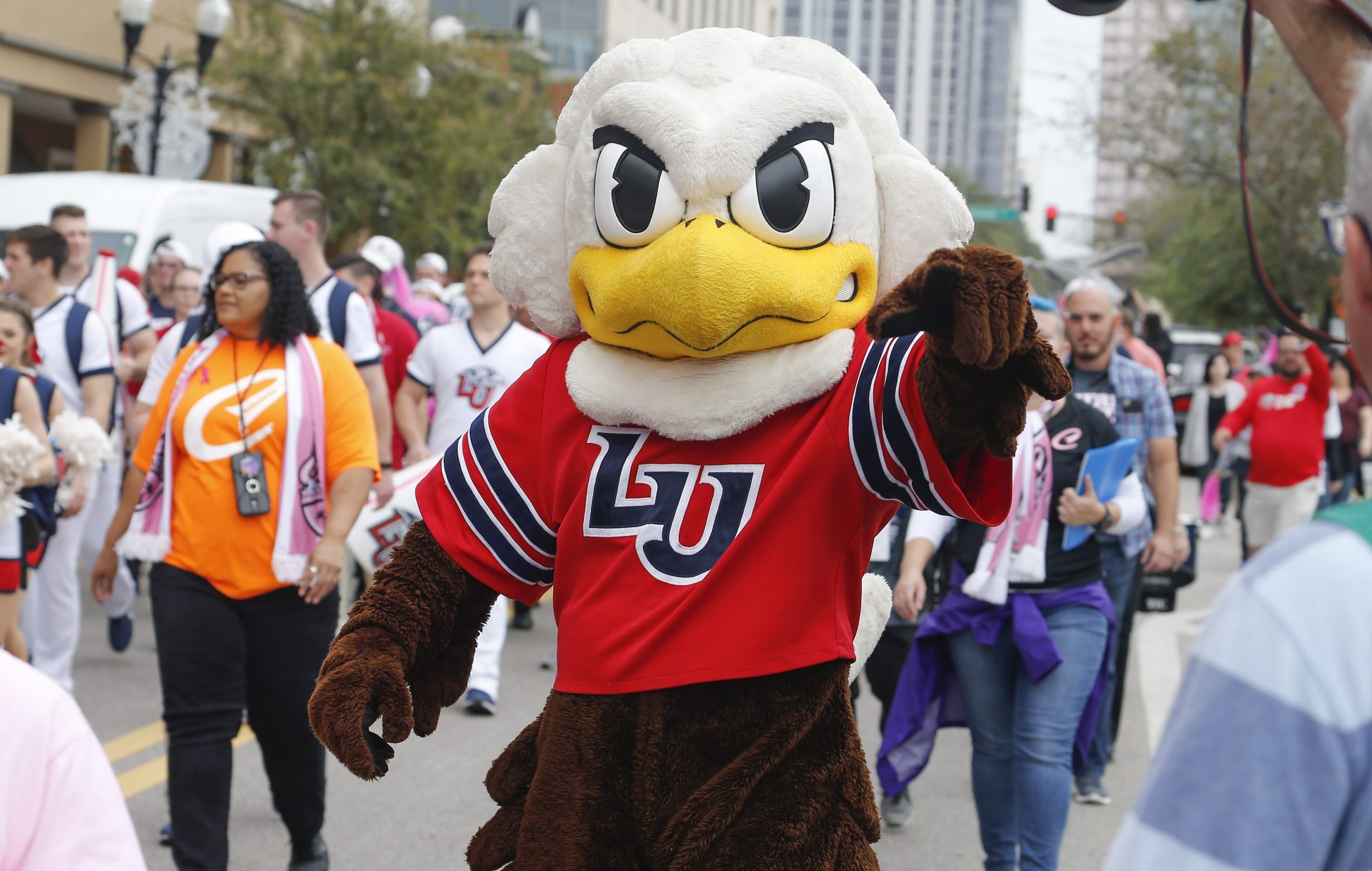 Dec 21, 2019; Orlando, Florida, USA; The Liberty Flames mascot walks during the cancer survivors march to the stadium before the game against Georgia Southern Eagles at Exploria Stadium. Mandatory Credit: Reinhold Matay-USA TODAY Sports