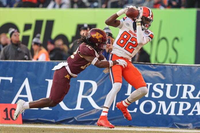 Dec 29, 2022; Bronx, NY, USA; Syracuse Orange wide receiver Damien Alford (82) makes a catch as Minnesota Golden Gophers defensive back Darius Green (12) defends during the first half of the 2022 Pinstripe Bowl at Yankee Stadium. Mandatory Credit: Vincent Carchietta-USA TODAY Sports