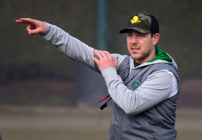 New Oregon offensive coordinator and quarterbacks coach Will Stein leads a drill on the first practice of spring for Oregon football as the Ducks prepare for the 2023 season. Eug 031623 Uo Spring Fb 15