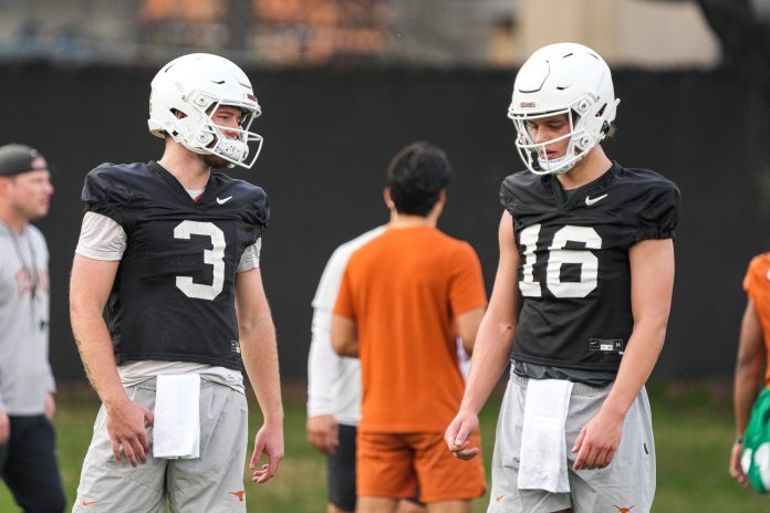 Quarterbacks Quinn Ewers (3) and Arch Manning (16) talk during the first Texas Longhorns football practice of 2023 at the Frank Denius Fields on the University of Texas at Austin campus on Monday, March 6, 2023.