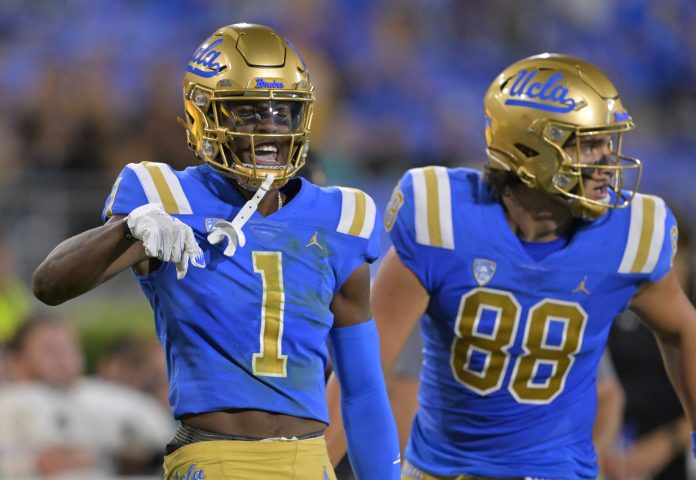 Sep 2, 2023; Pasadena, California, USA; UCLA Bruins wide receiver J. Michael Sturdivant (1) celebrates after a completion on a long pass from quarterback Dante Moore (3) in the first half against the Coastal Carolina Chanticleers at Rose Bowl. Mandatory Credit: Jayne Kamin-Oncea-USA TODAY Sports