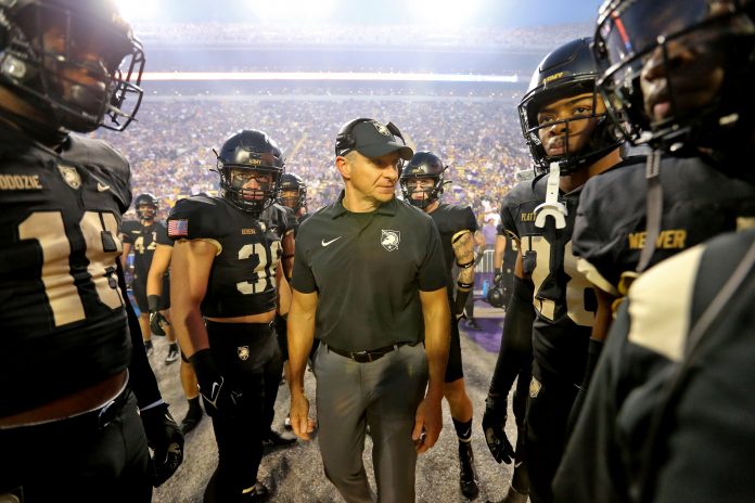 Oct 21, 2023; Baton Rouge, Louisiana, USA; Army Black Knights head coach Jeff Monken talks to his players on the sideline during the first half against the LSU Tigers at Tiger Stadium. Mandatory Credit: Danny Wild-USA TODAY Sports