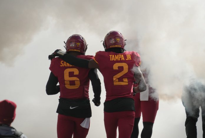 Iowa State defensive back T.J. Tampa (2) puts his arm around teammate Eli Sanders (6) as they take the field prior to kickoff against West Virginia during a NCAA football game at Jack Trice Stadium in Ames on Saturday, Nov. 5, 2022.