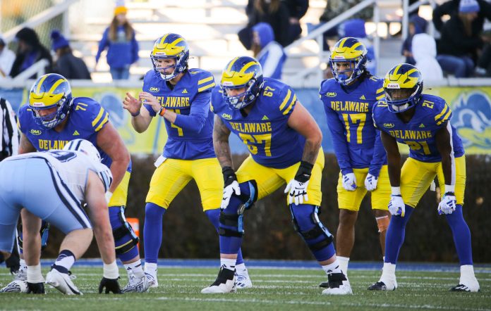 Delaware quarterback Nick Minicucci lines up with (from left) Patrick Shupp (71), Blaise Sparks (67), Jourdan Townsend (17), and Marcus Yarns in the third quarter of the Blue Hens' 35-7 loss at Delaware Stadium, Saturday, Nov. 18, 2023.
