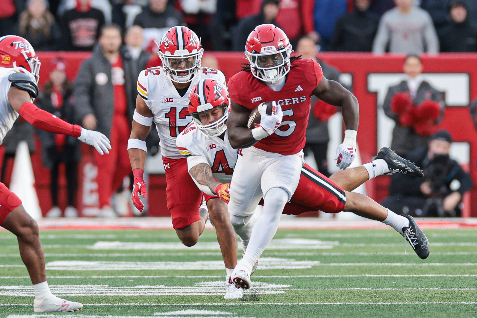 Nov 25, 2023; Piscataway, New Jersey, USA; Rutgers Scarlet Knights running back Kyle Monangai (5) carries the ball as linebacker Caleb Wheatland (44) tackles during the first half at SHI Stadium. Mandatory Credit: Vincent Carchietta-USA TODAY Sports