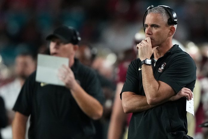 Dec 30, 2023; Miami Gardens, FL, USA; Florida State Seminoles head coach Mike Norvell reacts against the Georgia Bulldogs during the second half in the 2023 Orange Bowl at Hard Rock Stadium. Mandatory Credit: Jasen Vinlove-USA TODAY Sports