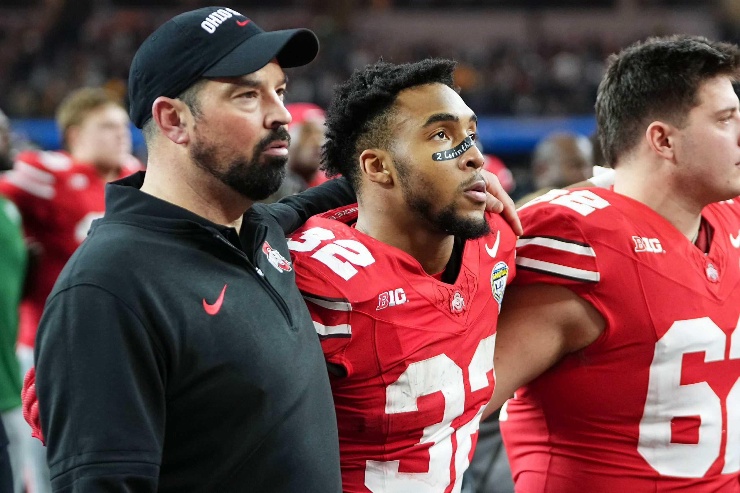 Dec 29, 2023; Arlington, Texas, USA; Ohio State Buckeyes head coach Ryan Day and running back TreVeyon Henderson (32) sing “Carmen Ohio” following their 14-3 loss to the Missouri Tigers in the Goodyear Cotton Bowl Classic at AT&T Stadium.