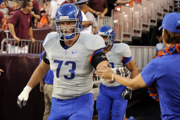 September 6, 2010; Landover, MD, USA; Boise State Broncos offensive lineman Nate Potter is greeted by a fan prior to a game against the Virginia Tech Hokies at FedEx Field. Mandatory Credit: Rafael Suanes-USA TODAY Sports