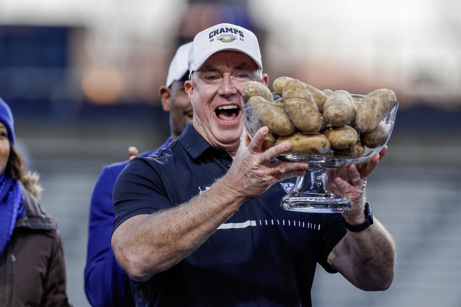 Georgia State Panthers head coach Shawn Elliott hoists the Famous Idaho Potato Bowl trophy after the game.