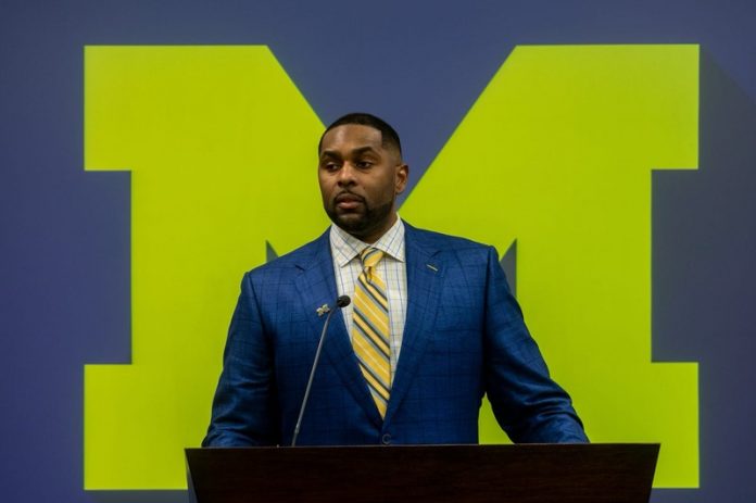 Sherrone Moore, Michigan's new head coach, speaks in front of family, media, and University of Michigan faculty members during a press conference inside the Junge Family Champions Center.