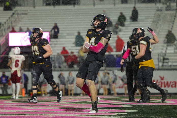 Appalachian State Mountaineers quarterback Joey Aguilar (4) celebrates after scoring a touchdown against the Miami (OH) Redhawks in the third quarter in the third quarter during the Avocados from Mexico Cure Bowl at FBC Mortgage Stadium.