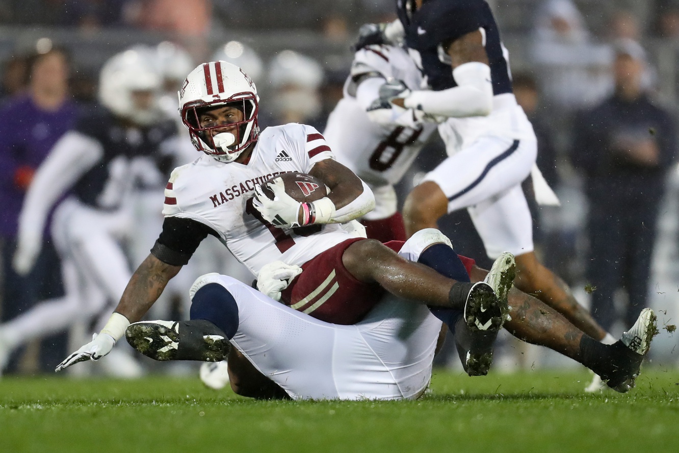 Massachusetts Minutemen running back Kay'Ron Lynch-Adams (15) is tackled by Penn State Nittany Lions defensive tackle Dvon Ellies (91) during the third quarter at Beaver Stadium. Penn State won 63-0.