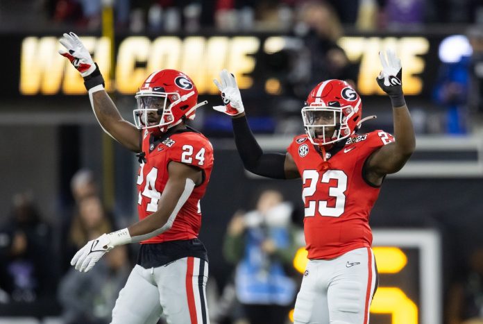 Georgia Bulldogs defensive back Malaki Starks (24) and defensive back Tykee Smith (23) against the TCU Horned Frogs during the CFP national championship game at SoFi Stadium.