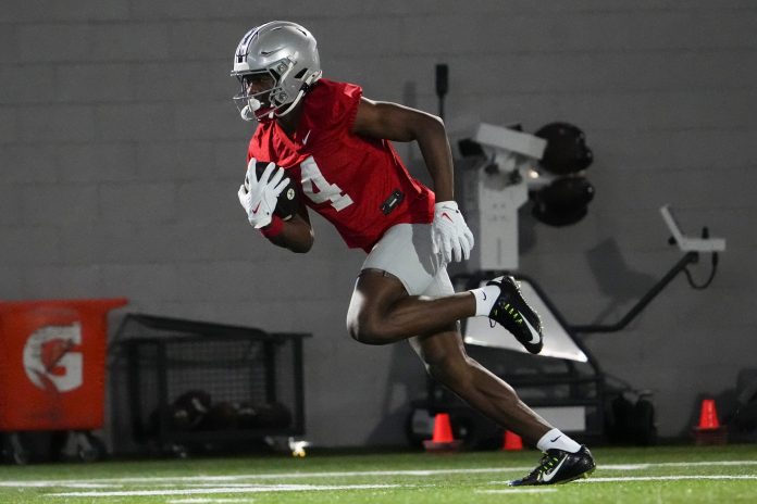 Ohio State Buckeyes wide receiver Jeremiah Smith (4) catches a pass during spring football practice at the Woody Hayes Athletic Center.