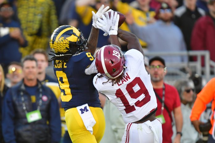 Alabama Crimson Tide wide receiver Kendrick Law (19) cannot make a catch against Michigan Wolverines defensive back Rod Moore (9) in the second quarter in the 2024 Rose Bowl college football playoff semifinal game at Rose Bowl.