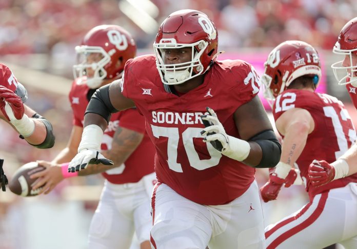 Oklahoma's Cayden Green (70) prepares to block in the first half of the college football game between the University of Oklahoma Sooners and the University of Central Florida Knights.