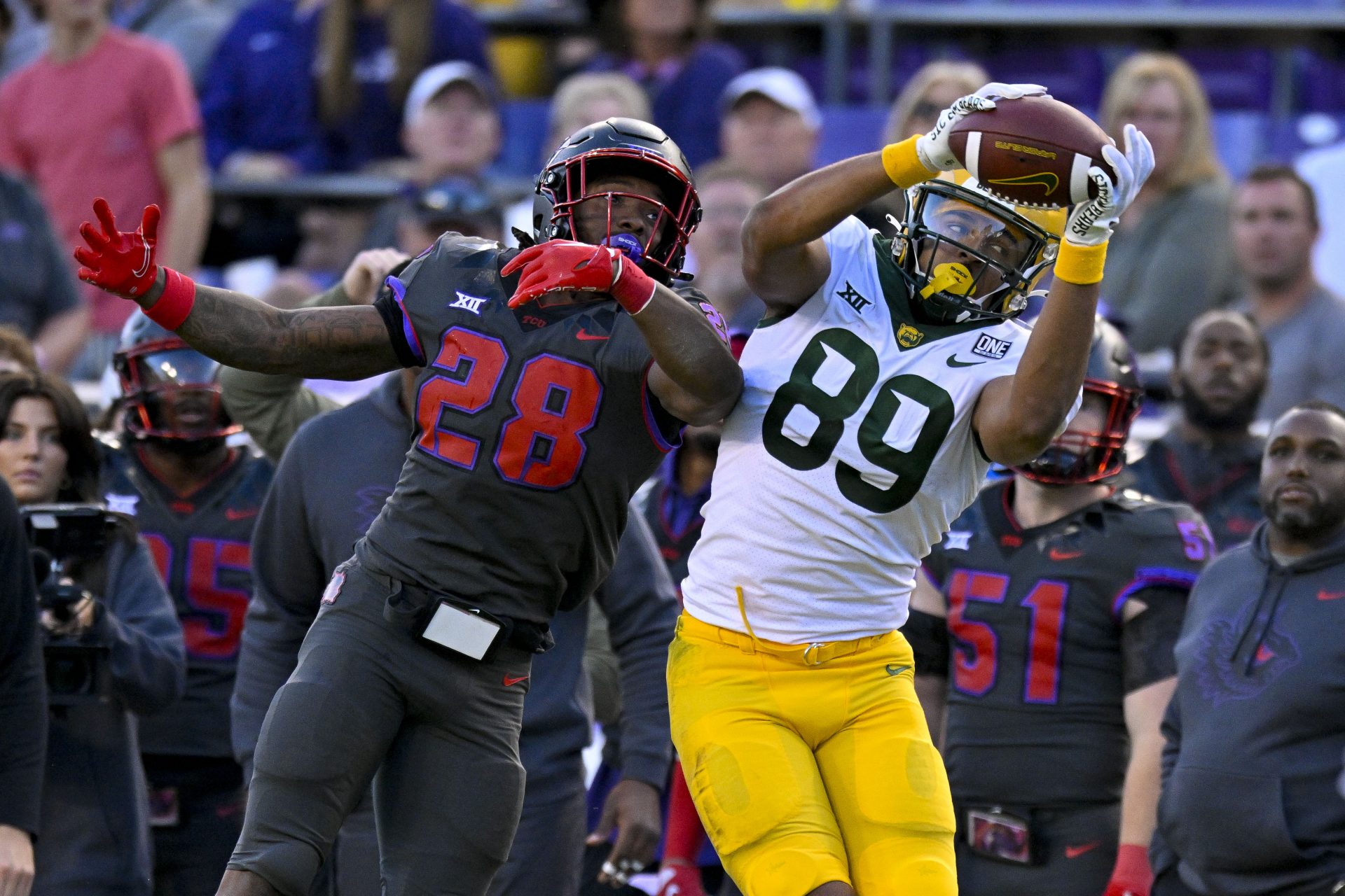 Nov 18, 2023; Fort Worth, Texas, USA; Baylor Bears tight end Drake Dabney (89) catches a pass over TCU Horned Frogs safety Millard Bradford (28) during the second half at Amon G. Carter Stadium. Mandatory Credit: Jerome Miron-USA TODAY Sports