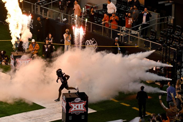 Dec 2, 2023; Arlington, TX, USA; The Oklahoma State Cowboys take the field to face the Texas Longhorns before the game at AT&T Stadium. Mandatory Credit: Jerome Miron-USA TODAY Sports