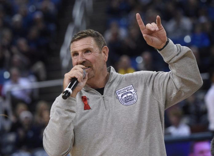 New Nevada head football coach Jeff Choate helps fire up the crowd while taking on UC Davis at Lawlor Events Center in Reno on Dec. 6, 2023.