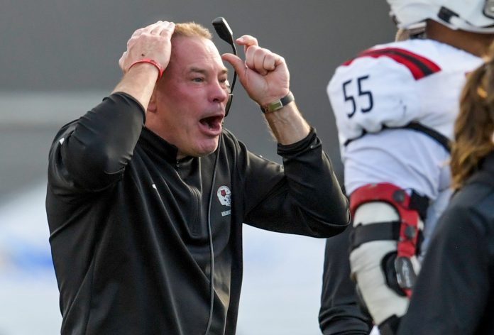 Arkansas State Red Wolves head coach Butch Jones coaches against the Northern Illinois Huskies in the Camellia Bowl at Cramton Bowl in Montgomery, Ala., on Saturday December 23, 2023.