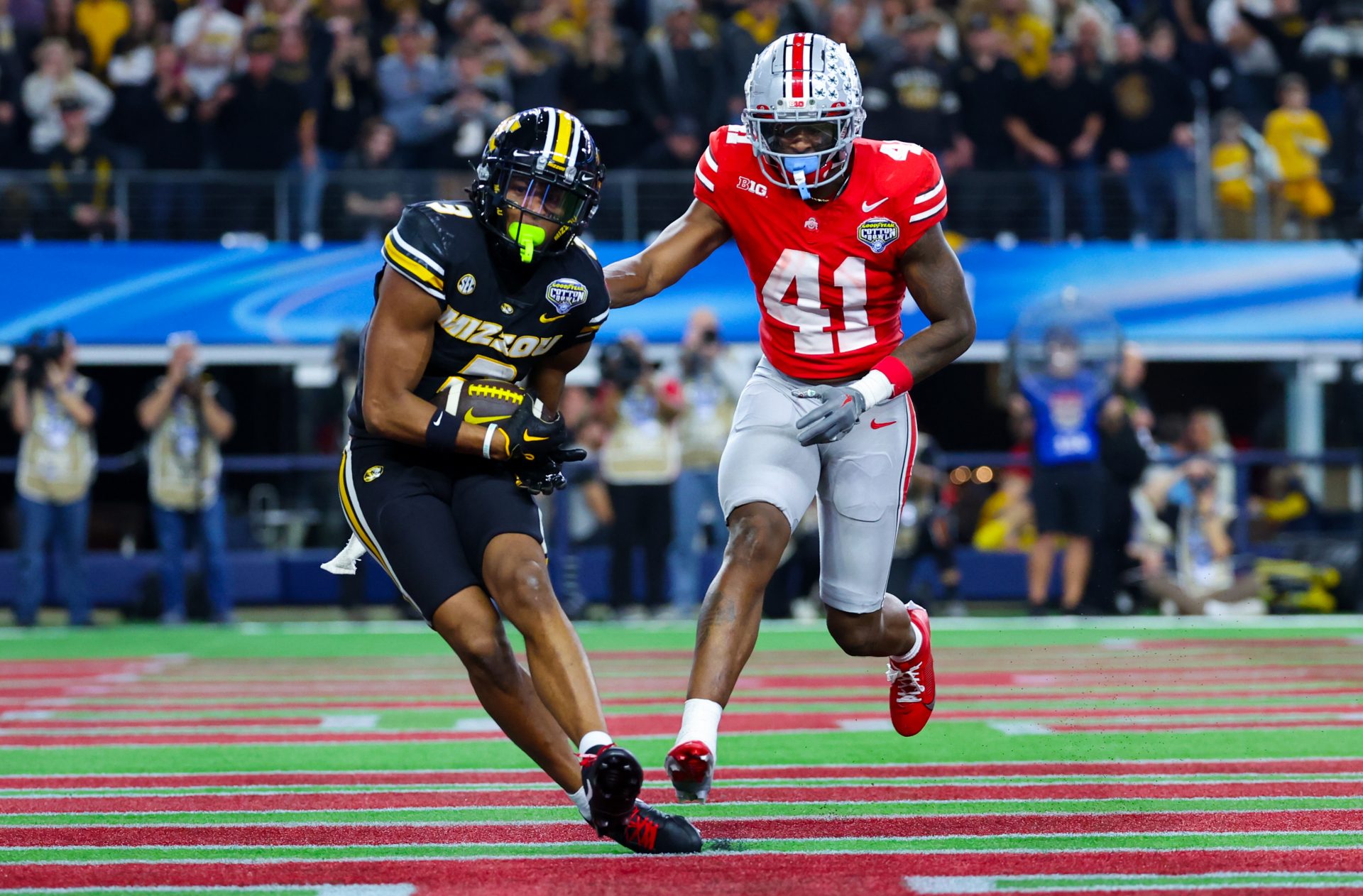 Dec 29, 2023; Arlington, TX, USA; Missouri Tigers wide receiver Luther Burden III (3) catches a touchdown pass past Ohio State Buckeyes safety Josh Proctor (41) during the second half at AT&T Stadium. Mandatory Credit: Kevin Jairaj-USA TODAY Sports